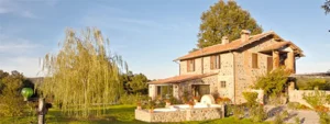 Rustic Italian villa surrounded by gardens and rolling countryside