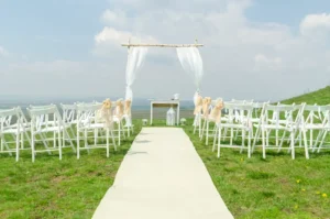 Simple outdoor ceremony setup overlooking the water