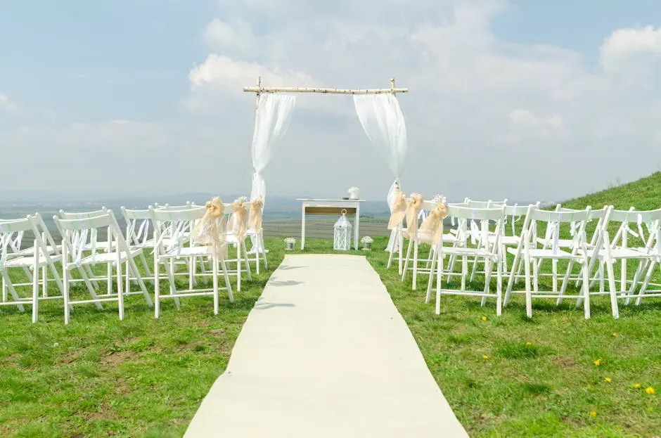 Simple outdoor ceremony setup overlooking the water