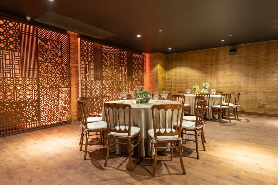 Intimate luxury event room with wood walls and round dining tables
