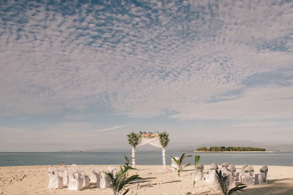 Beach wedding ceremony setup facing the ocean