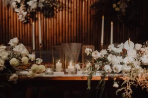Elegant candlelit wedding table with white orchids