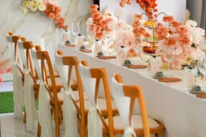 Modern peach and blush event table with floral decor