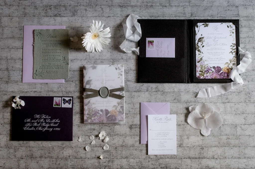 Wedding stationery, planning notes, floral details, and design materials arranged for event coordination.